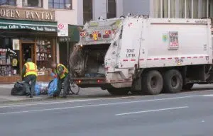 The update specifies that drivers must provide sanitation workers with a buffer of about 50 feet. Photo courtesy Janine and Tim Eden via Flickr.