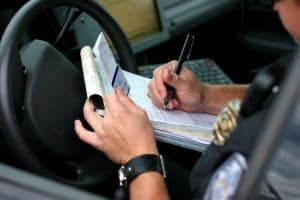 NY cop finishing a traffic ticket