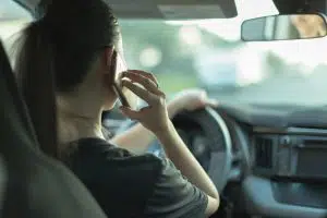 woman on the phone while driving NY
