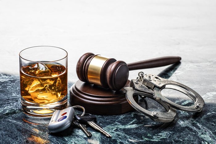 drinking and driving drink and handcuffs
